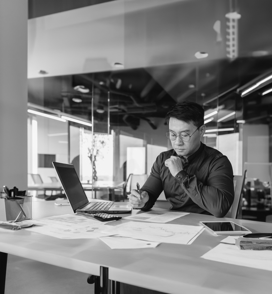 https://brandportal.ideagen.com/m/10923300b2d17090/webimage-SINGLE-IMAGE_man-paperwork-black-and-white_feb24.png