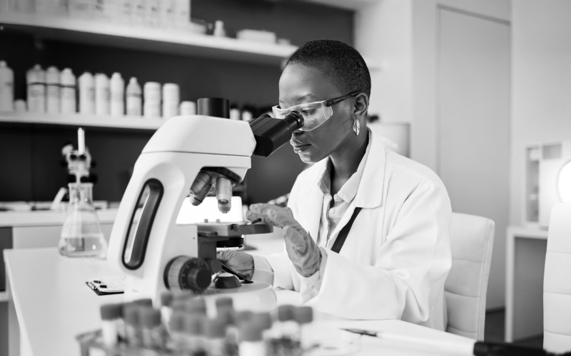 SINGLE-IMAGE_science-laboratory-and-woman-on-microscope-for-blood-test-research_mar25