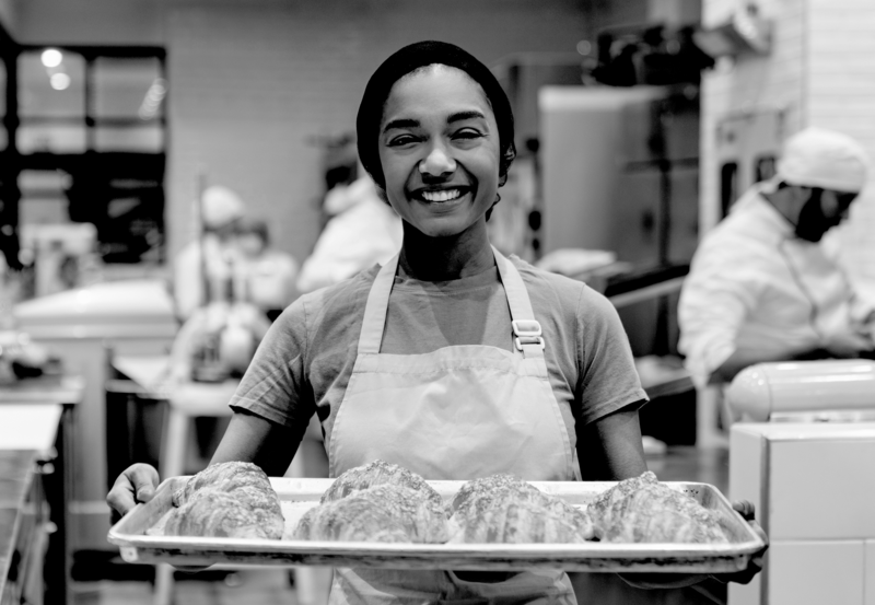 SINGLE-IMAGE_baker-with-croissants-on-tray_nov23