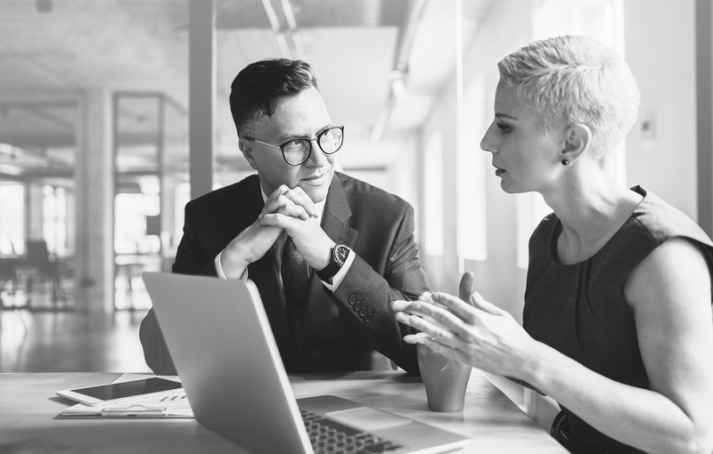 SINGLE-IMAGE_business-employees-discuss-financial-report-with-laptop_feb25
