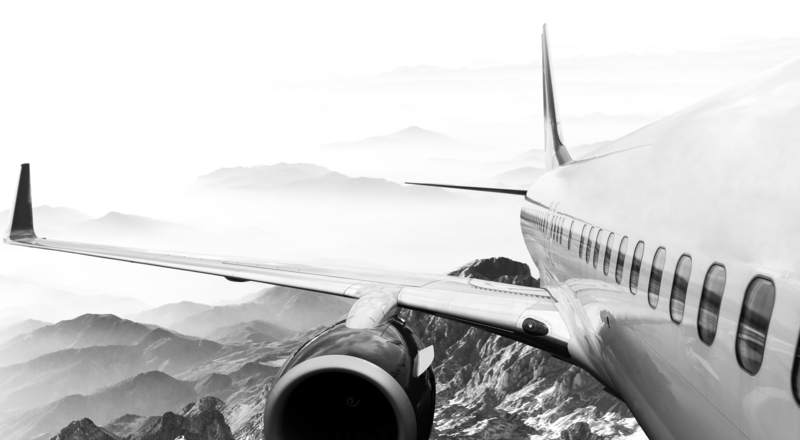 SINGLE-IMAGE_plane-in-flight-looking-back-over-wing-alt_nov23