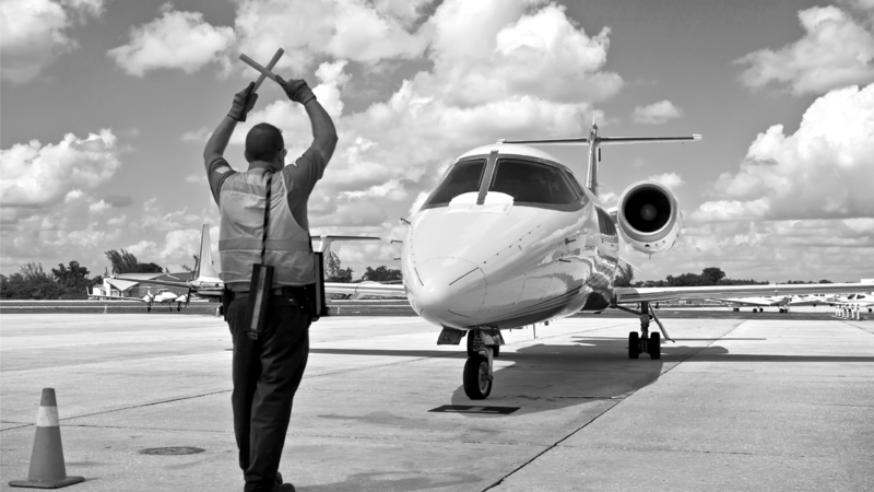 SINGLE-IMAGE_air-traffic-marshall-with-jet_nov23