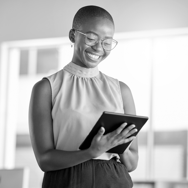 SINGLE-IMAGE_black-woman-smiling-with-tablet_aug24