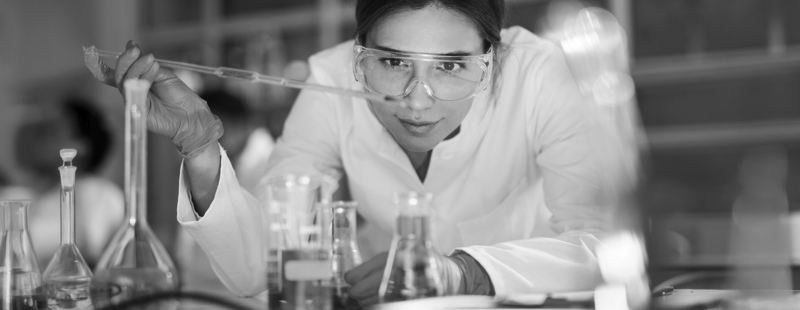 SINGLE-IMAGE_female-scientist-examining-liquid-in-laboratory_mar25