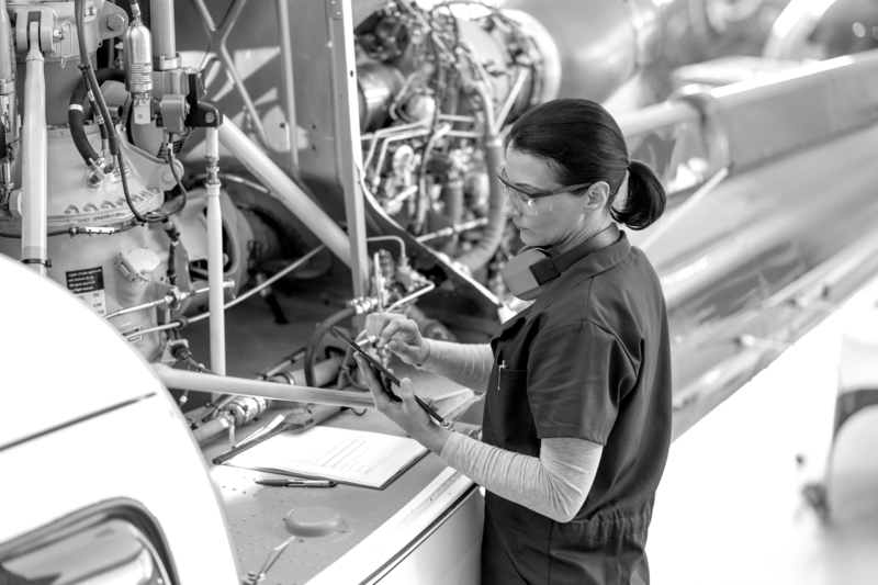 SINGLE-IMAGE_engineer-tablet-checking-airplane-engine_oct23