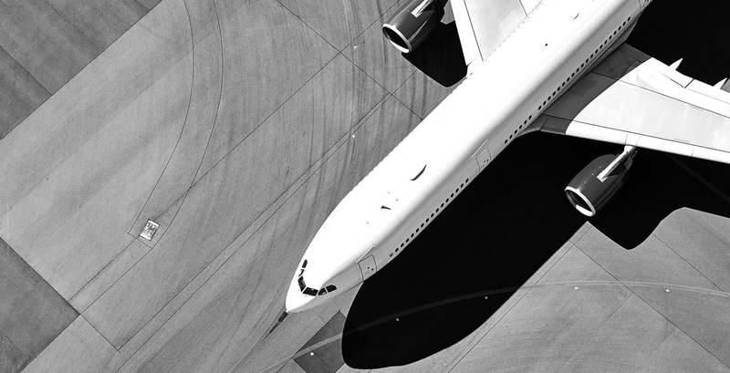 SINGLE-IMAGE_passenger-jet-runway-from-above_jul24