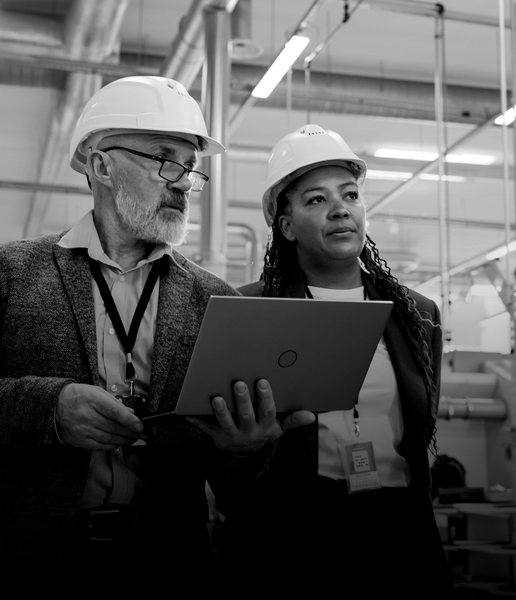 SINGLE-IMAGE_male-and-female-with-hard-hats-holding-laptop-no-squares_mar24