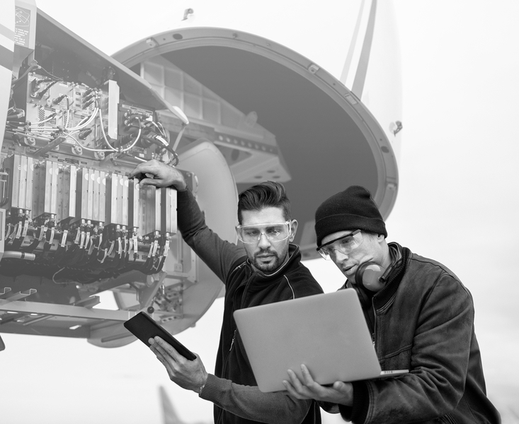 https://brandportal.ideagen.com/m/72967864dcd5edfa/webimage-SINGLE-IMAGE_aircraft-engineers-with-laptop_feb25.png