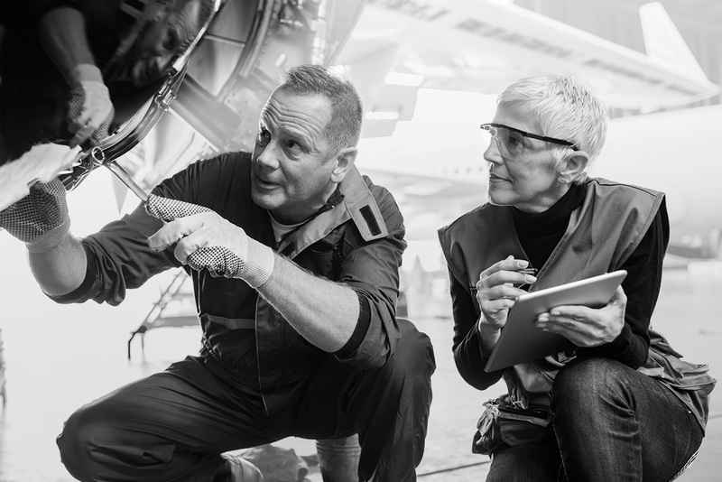 SINGLE-IMAGE_aircraft-engineers-with-digital-tablet_feb25