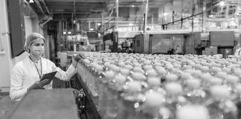 SINGLE-IMAGE_food-and-beverage-woman-factory-water-bottles_may24