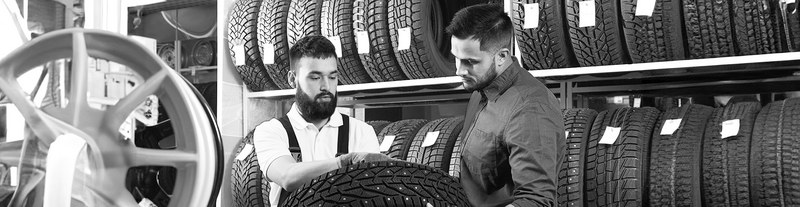 SINGLE-IMAGE_two-people-are-inspecting-the-tires_may24
