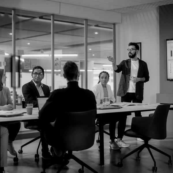 SINGLE-IMAGE_office-workers-in-meeting-no-squares_mar24